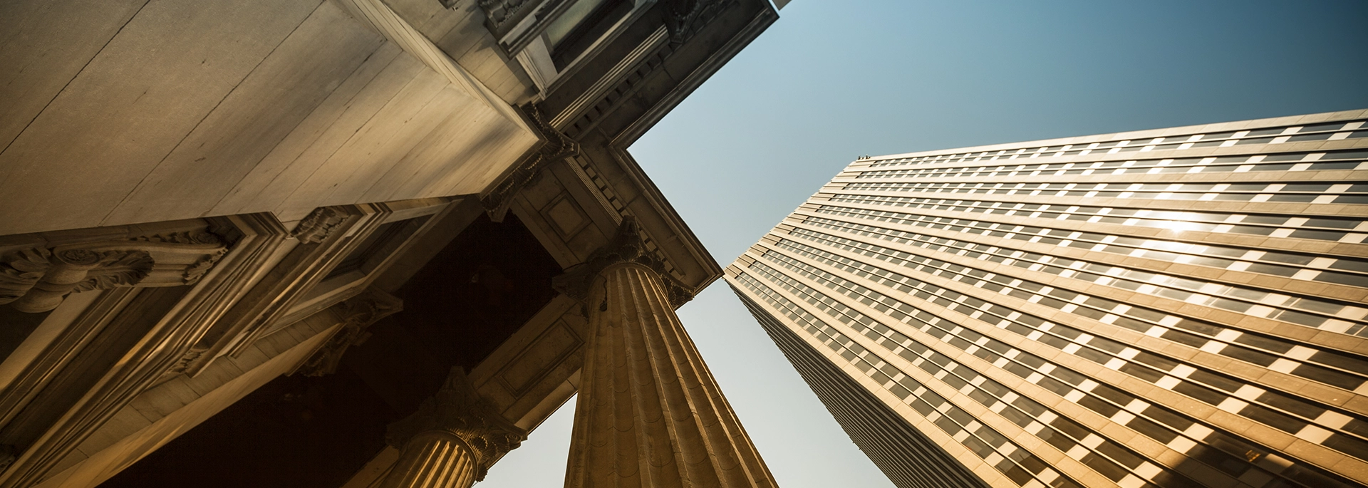 Bracewell tax practice banner image. There are several office buildings under a blue sky.