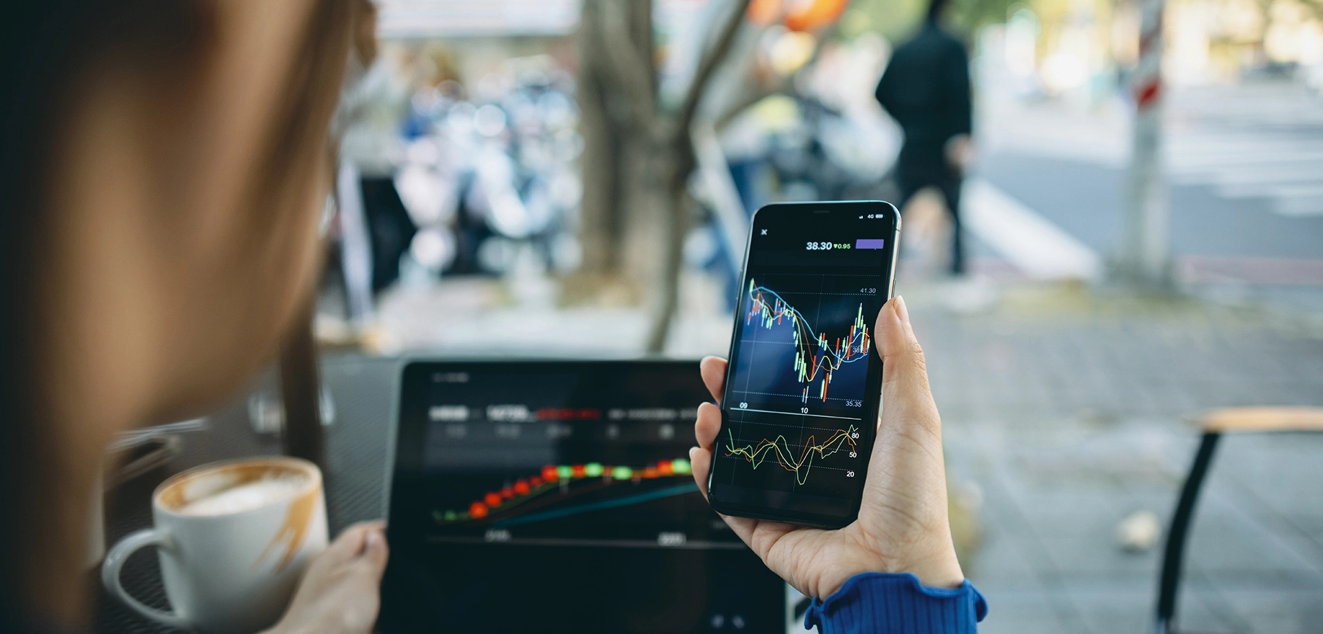 a person checking financial charts on her phone