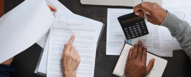 Bracewell Tax practice banner image, which shows two people reviewing documents and doing calculation.